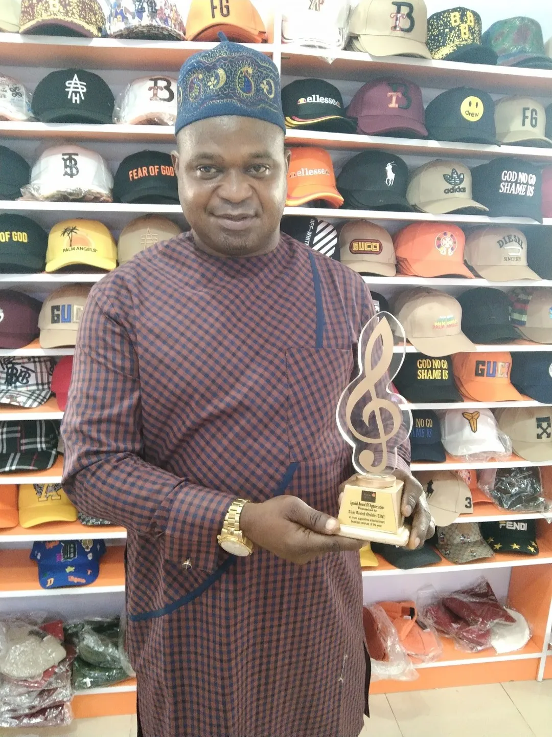 Stick to the Lyrics honoree holding a Stick to the Lyrics award
